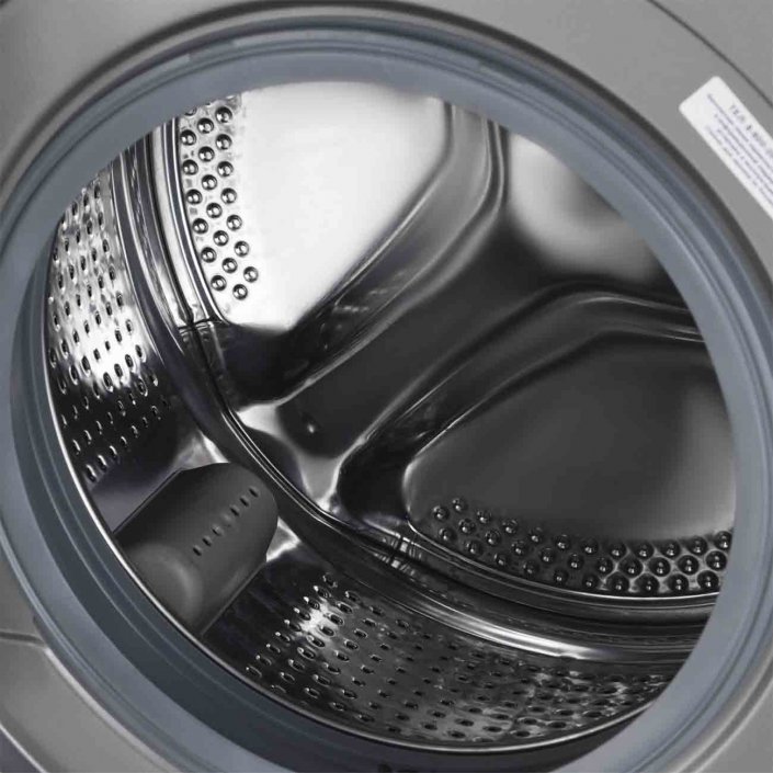 Beko WSPE7H616S барабан из нержавеющей стали крупным планом — перфорированная поверхность, диаметр люка 34 см